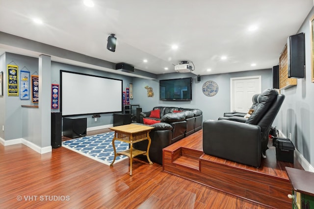 home theater room featuring hardwood / wood-style flooring