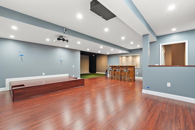 interior space with wood-type flooring and indoor bar