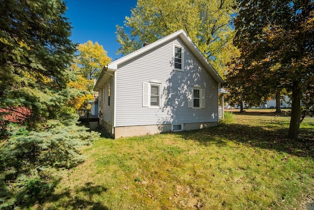 view of home's exterior featuring a lawn