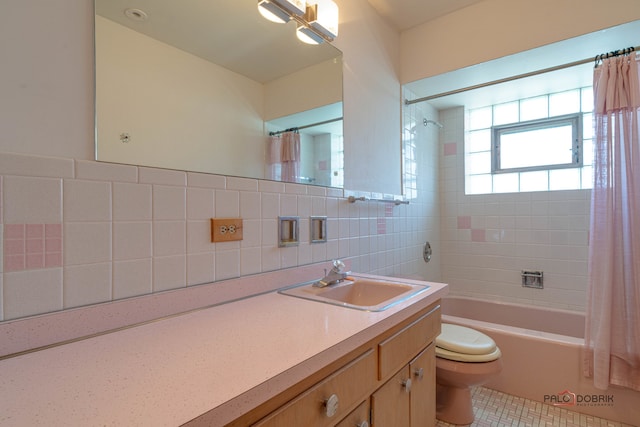 full bathroom with shower / bath combination with curtain, tile walls, tile patterned floors, vanity, and toilet