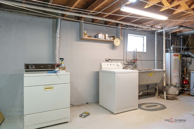 laundry room featuring gas water heater and independent washer and dryer