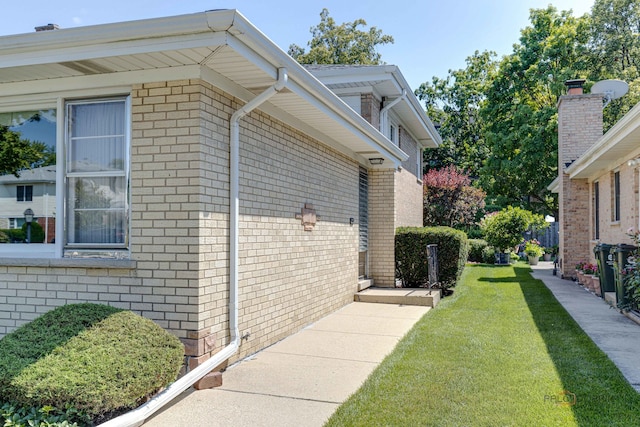 view of home's exterior with a yard