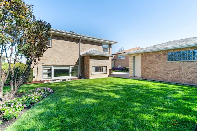 rear view of house with a lawn