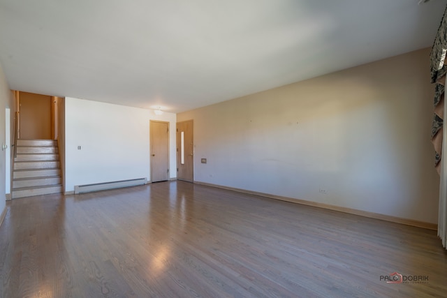 spare room featuring light hardwood / wood-style flooring and a baseboard radiator