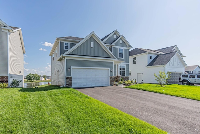 craftsman inspired home featuring a garage, driveway, a front lawn, and board and batten siding