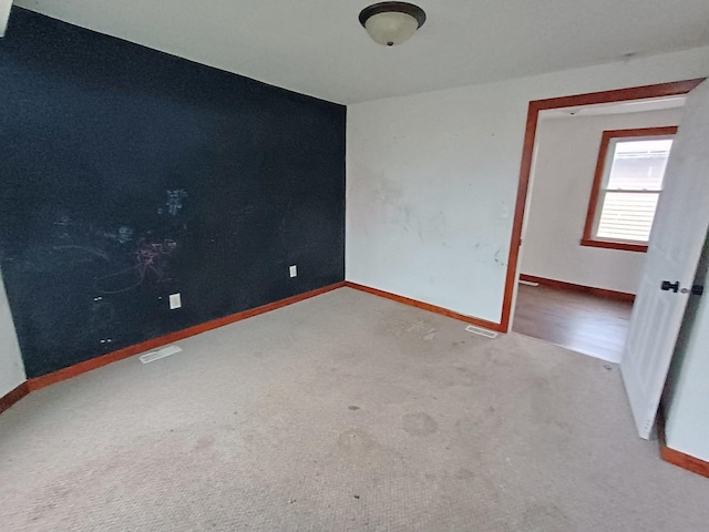 empty room featuring carpet flooring