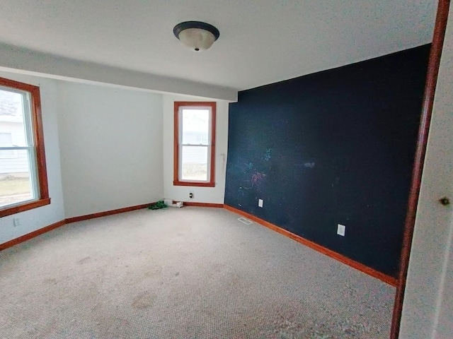 empty room featuring carpet floors