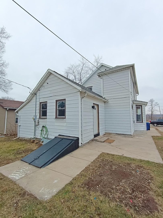 back of house with a patio