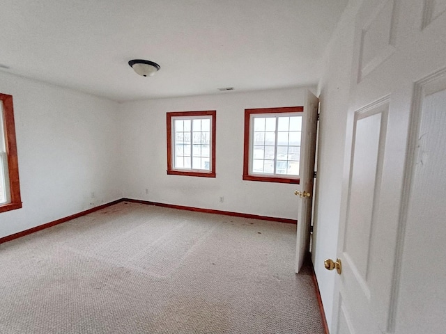 empty room featuring carpet floors