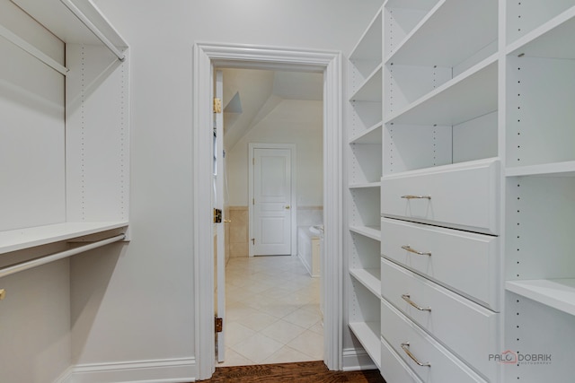 walk in closet featuring light tile patterned floors