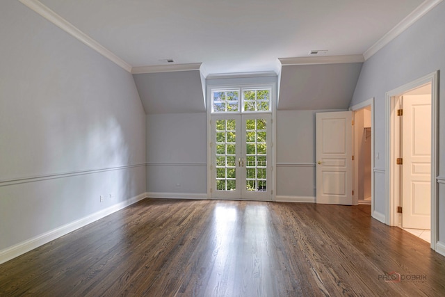 spare room with dark wood-type flooring, vaulted ceiling, french doors, and ornamental molding