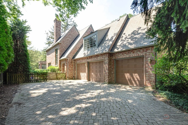 view of side of property with a garage