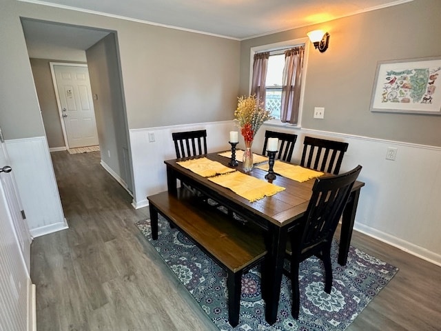 dining room featuring crown molding and hardwood / wood-style floors