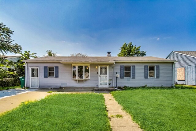 ranch-style house with a front lawn