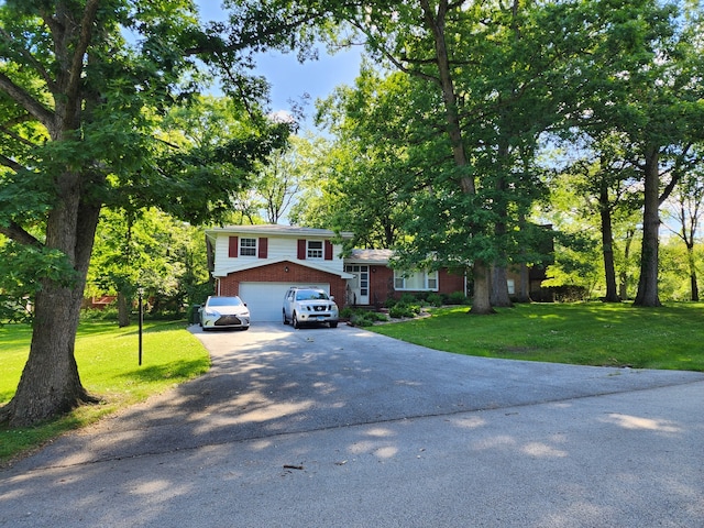 view of front of home featuring a garage and a front yard