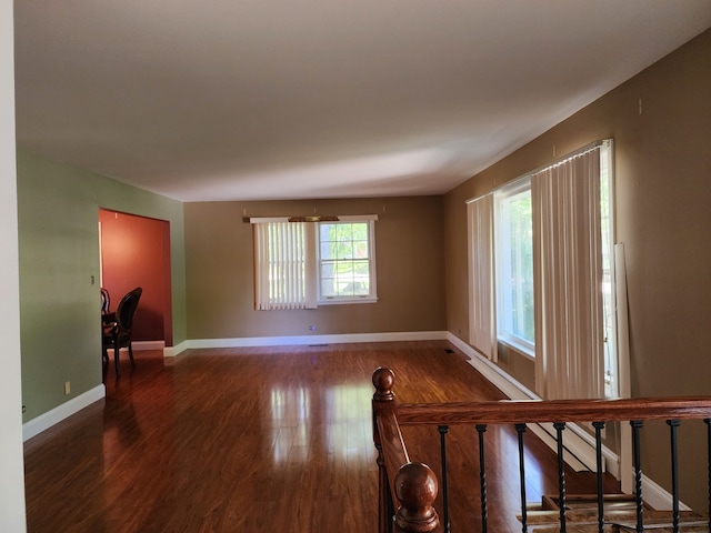 spare room with dark hardwood / wood-style floors