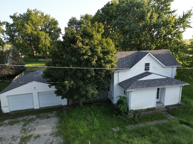 view of front facade with an outbuilding and a garage