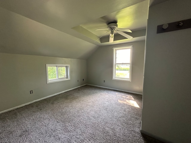 additional living space with ceiling fan, lofted ceiling, and carpet flooring