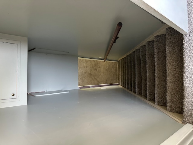 additional living space with concrete floors