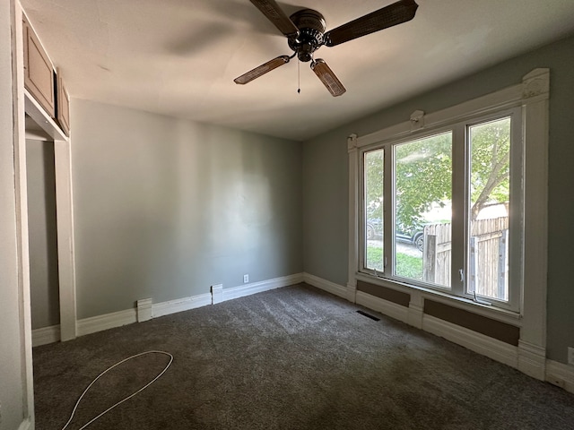 unfurnished bedroom featuring ceiling fan and carpet floors