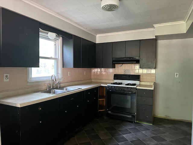 kitchen featuring backsplash, ornamental molding, sink, dark tile patterned flooring, and white range with gas stovetop