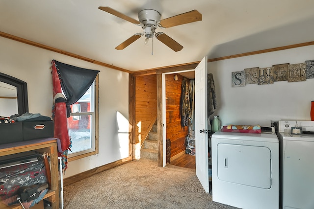 washroom featuring washer and clothes dryer, ceiling fan, crown molding, and carpet floors