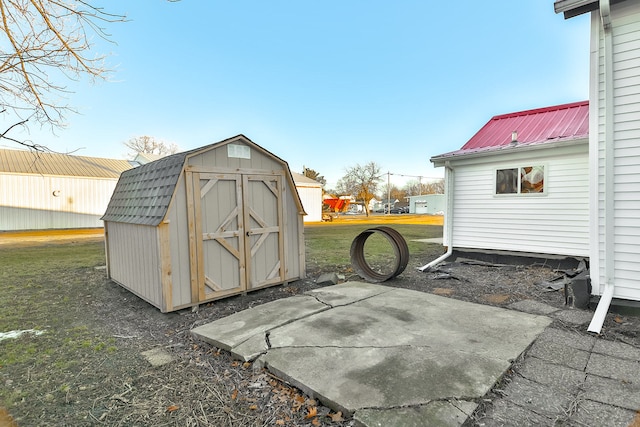 view of outbuilding featuring a lawn