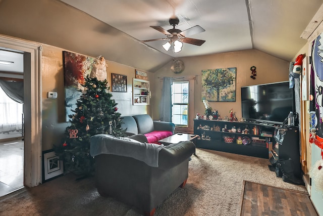 living room featuring hardwood / wood-style flooring, lofted ceiling, and ceiling fan