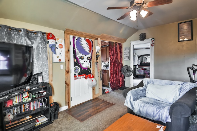 living room featuring lofted ceiling, carpet, and ceiling fan