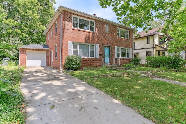 view of front of property with a garage and a front lawn