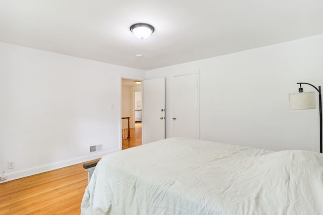 bedroom featuring hardwood / wood-style floors