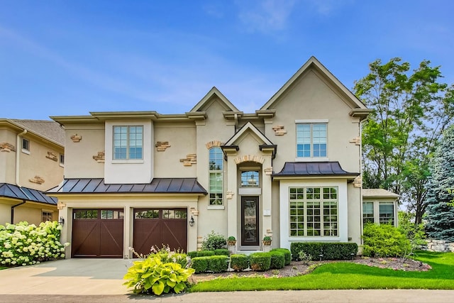 1 Willowcrest Dr, Oak Brook, IL 60523 - view of front of property with metal roof, a garage, driveway, and a standing seam roof