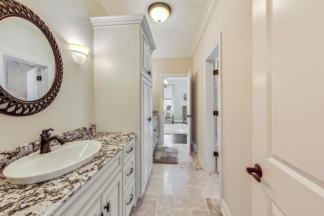 1 Willowcrest Dr, Oak Brook, IL 60523 - ensuite bathroom featuring crown molding, ensuite bath, vanity, baseboards, and stone tile flooring