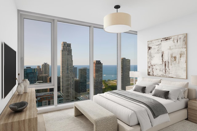 bedroom featuring expansive windows and light wood-type flooring