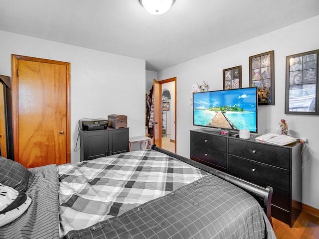 bedroom with hardwood / wood-style floors