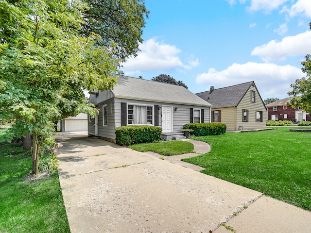 view of front of property featuring a garage and a front lawn