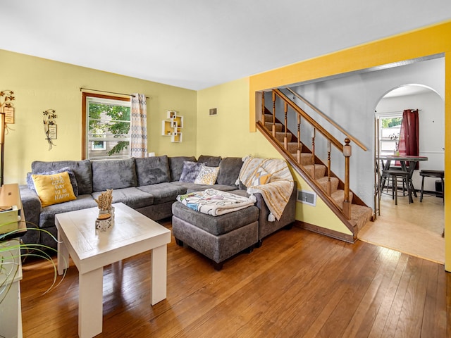 living room featuring a wealth of natural light and hardwood / wood-style floors