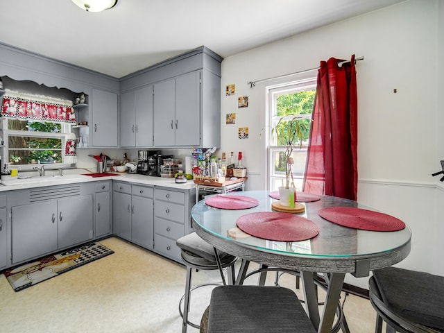 kitchen with gray cabinets and sink