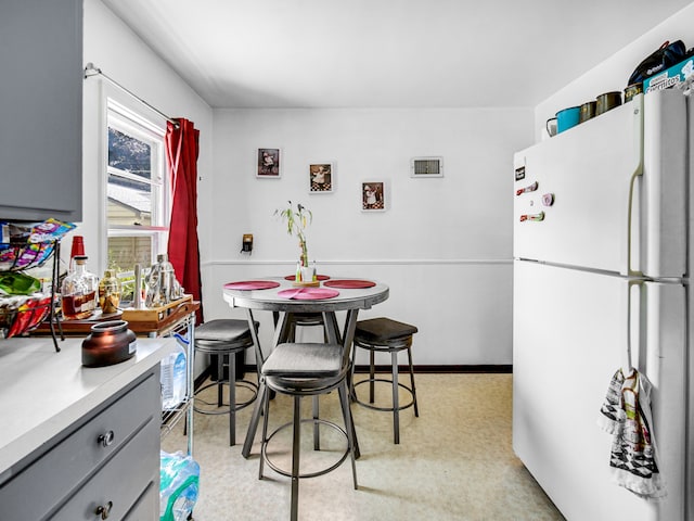 dining area with light carpet