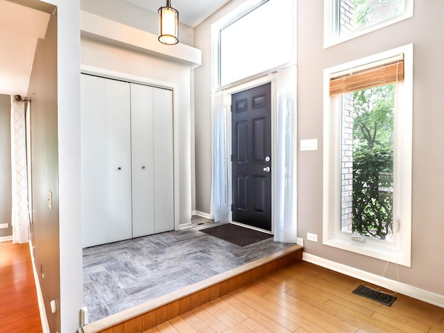 entrance foyer with hardwood / wood-style floors