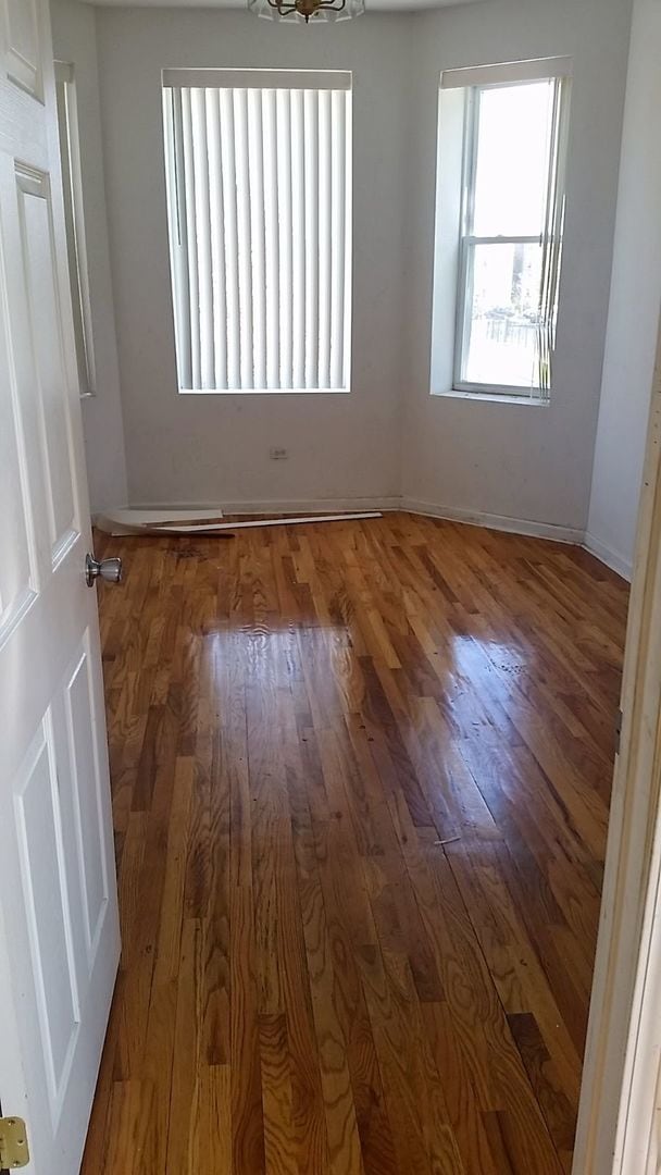 empty room with dark wood-type flooring