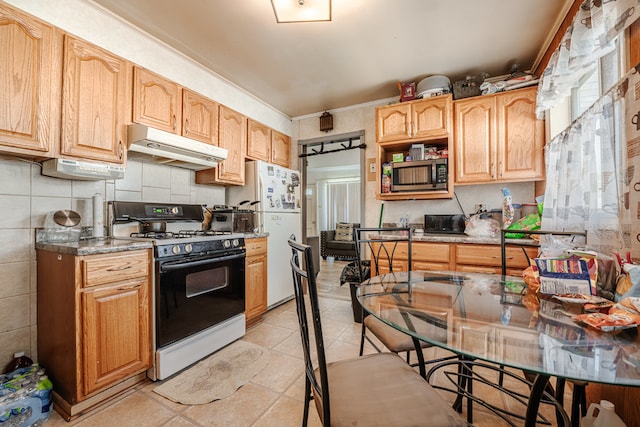 kitchen with backsplash, white appliances, and light tile patterned floors