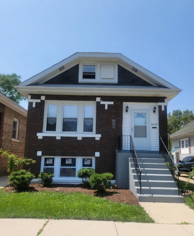 view of front facade featuring brick siding