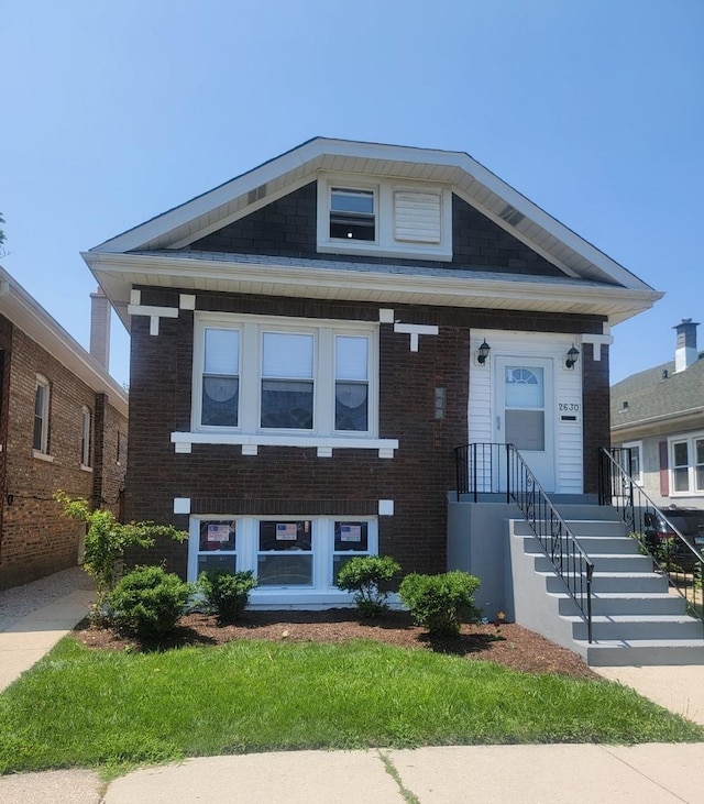 view of front of house featuring brick siding