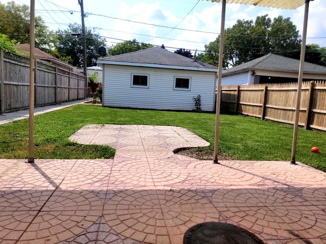 view of patio with an outdoor structure and a fenced backyard