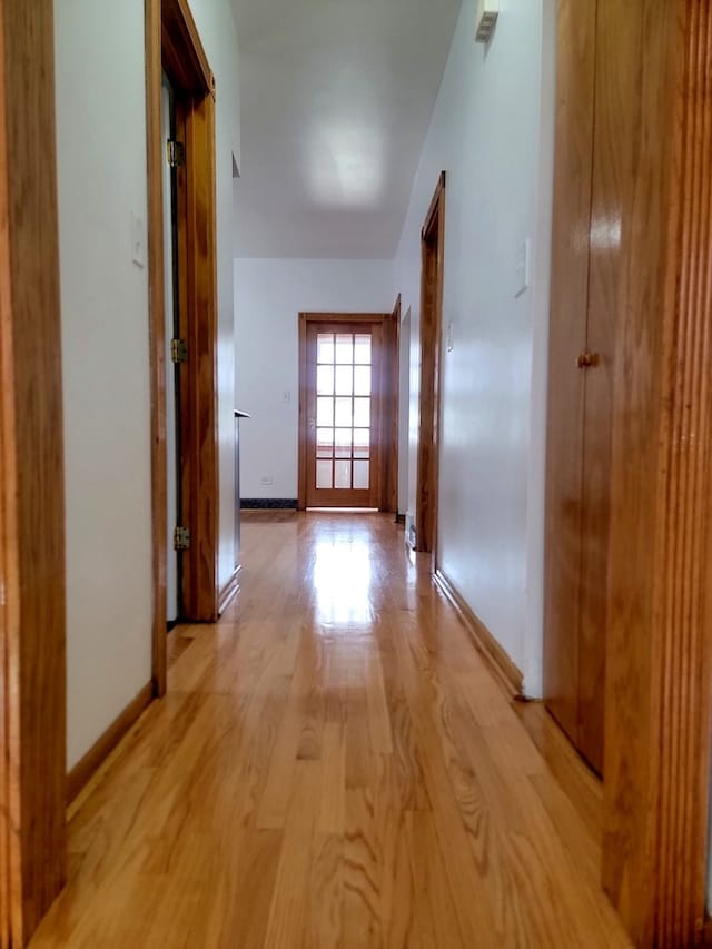 hall with light hardwood / wood-style flooring