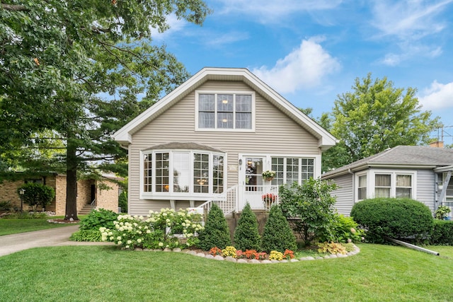 view of side of home with a lawn