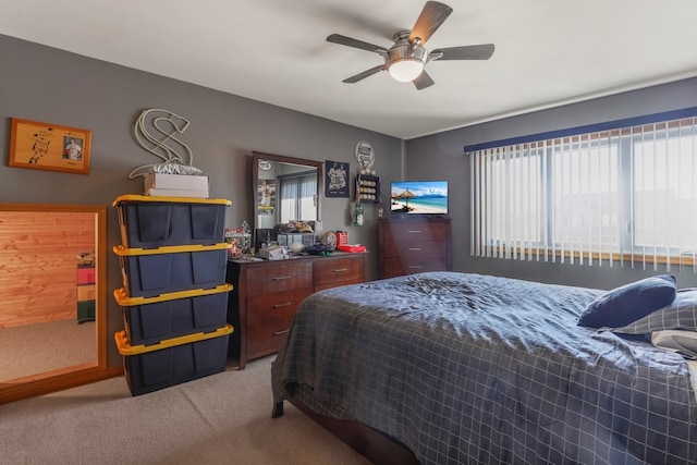 bedroom featuring light colored carpet and ceiling fan