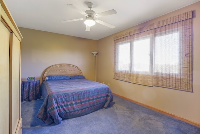 bedroom featuring carpet flooring, ceiling fan, and a closet