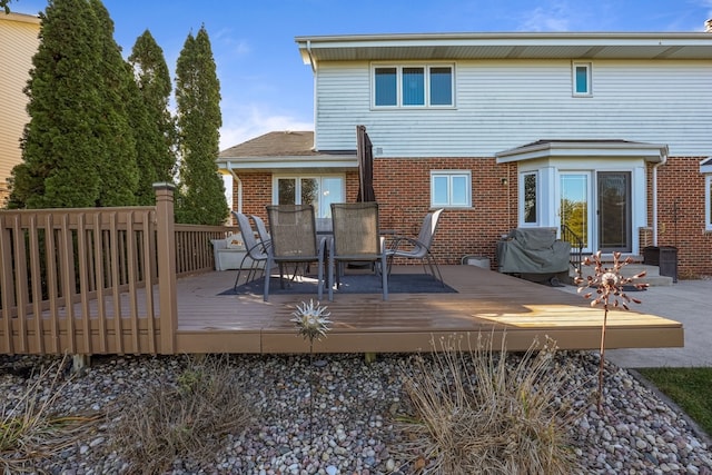 rear view of house featuring a deck